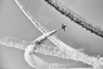 Low angle view of airplane flying in sky