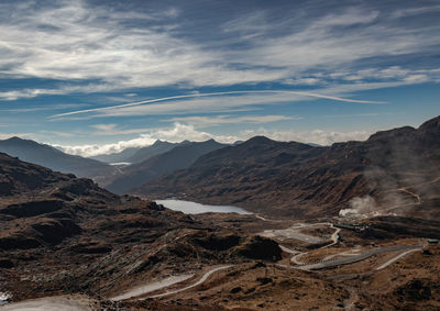 Himalayan breathtaking landscape with bright blue sky and twisty adventurous valley road