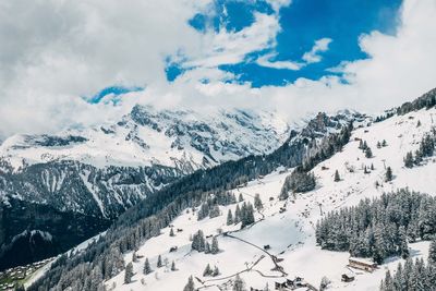 Scenic view of snow covered mountains against sky