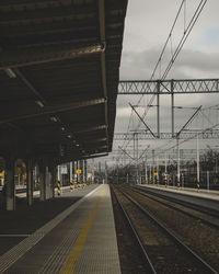 Railroad station platform against sky