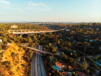 High angle view of buildings and trees against sky