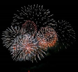 Low angle view of firework display at night