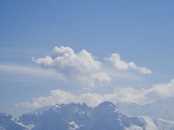 Scenic view of mountains against sky in winter