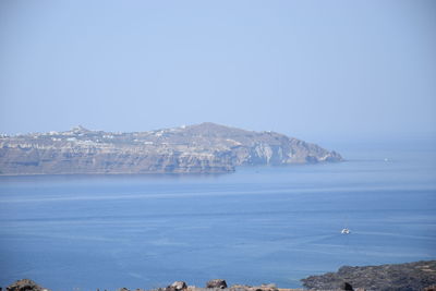 Scenic view of bay against clear blue sky