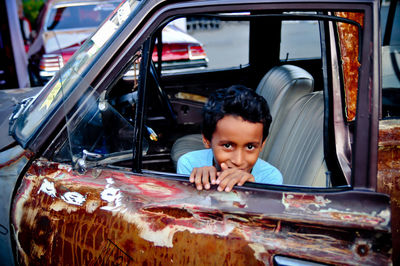 Portrait of boy in car