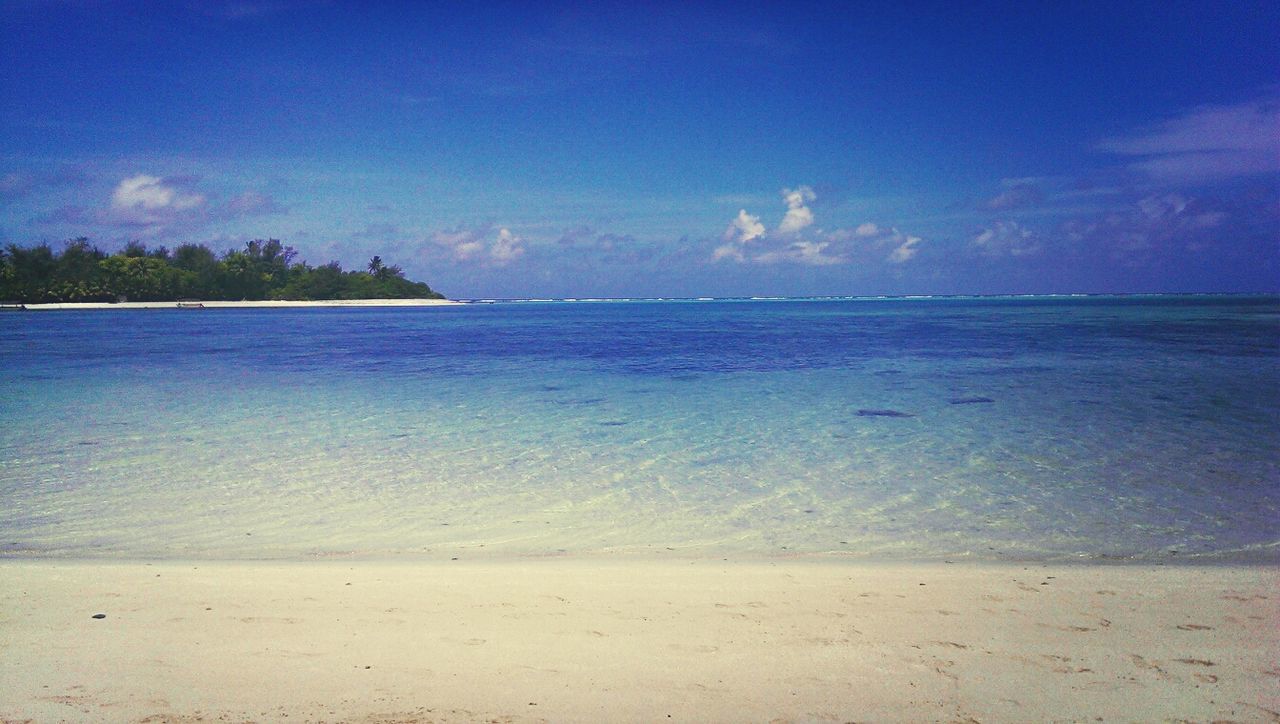 sea, water, horizon over water, beach, tranquil scene, sky, blue, tranquility, scenics, beauty in nature, shore, nature, sand, idyllic, cloud, cloud - sky, calm, coastline, seascape, remote