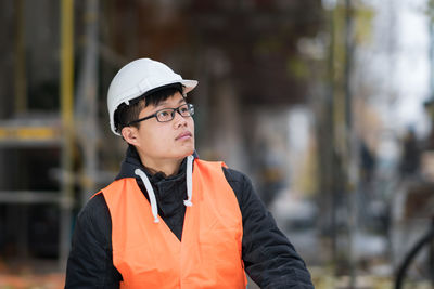 Engineer in reflective clothing standing outdoors