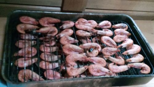 High angle view of meat on barbecue grill