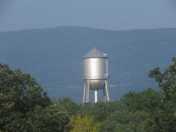 Scenic view of water tower against sky