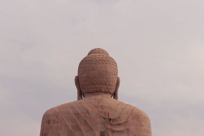 Low angle view of statue against sky