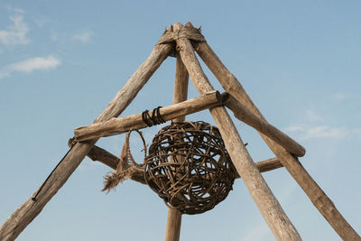 Low angle view of metallic structure against sky