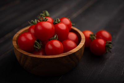 Close-up of tomatoes in basket on table