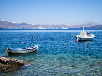 Sailboat on sea against clear sky