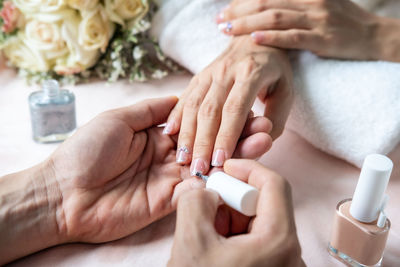 Midsection of woman holding hands