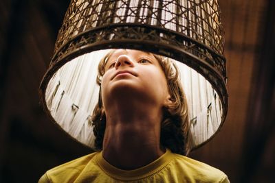 Young woman in lighting equipment