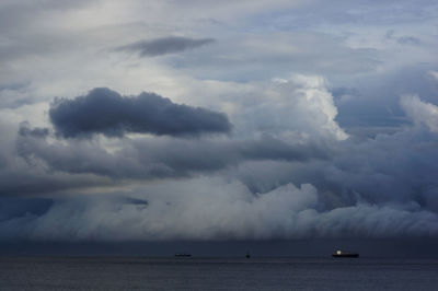 Scenic view of sea against cloudy sky