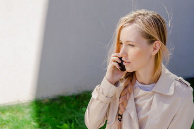 Young woman talking over phone