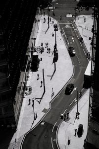 High angle view of street and footpath during sunny day