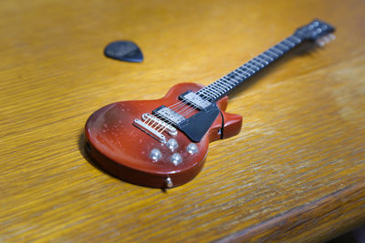 Close-up of guitar on table