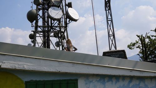 Low angle view of building against cloudy sky