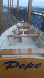 Close-up of table by sea against sky