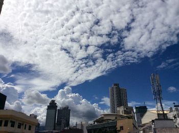 Low angle view of building against cloudy sky