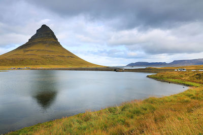 Scenic view of lake and mountains against sky