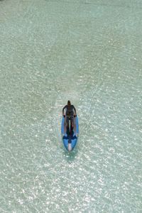 High angle view of woman swimming in pool