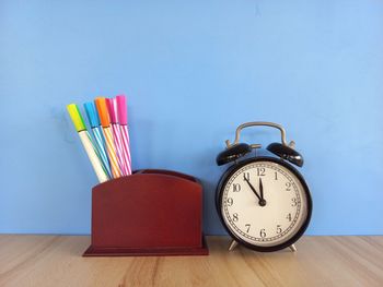 Close-up of clock on table