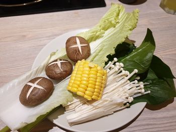 High angle view of eggs in plate on table