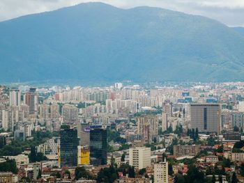 High angle view of buildings in city against sky