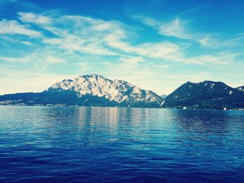 Scenic view of sea against blue sky