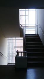 Low angle view of man standing on staircase