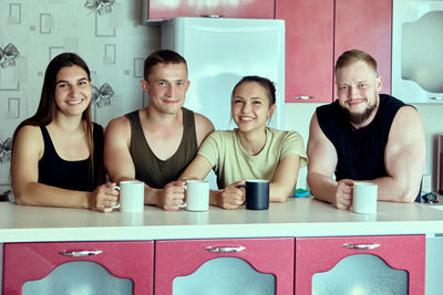 Portrait of young woman standing in store