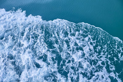 High angle view of water splashing in sea