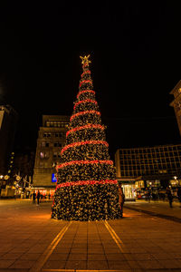 Illuminated christmas tree at night