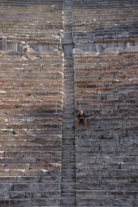 Man on brick wall