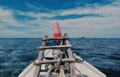 Sailboat sailing on sea against sky