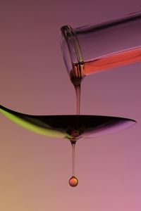 Close-up of wineglass against white background