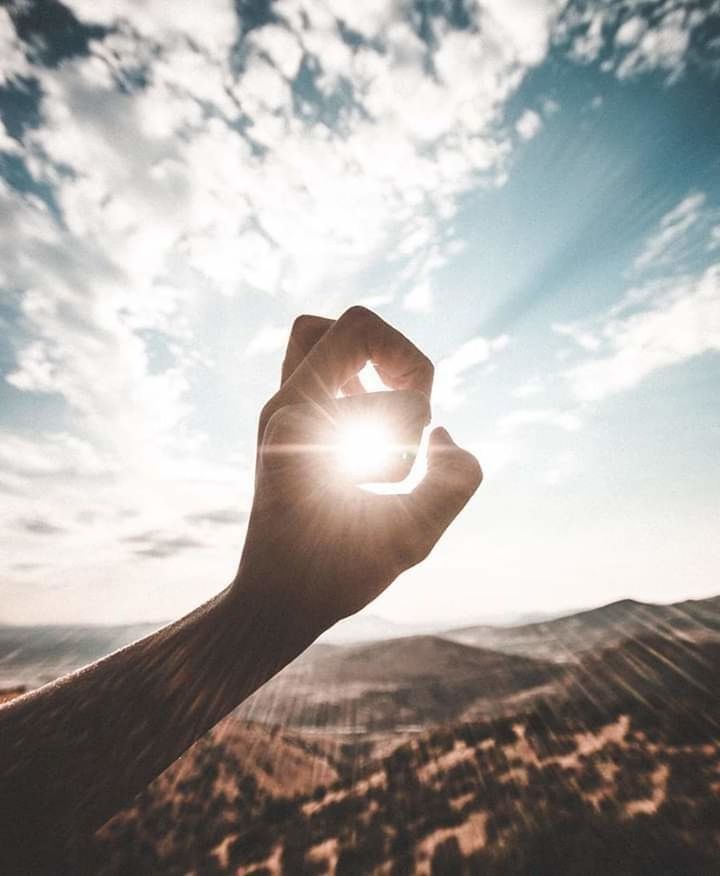 human hand, sky, hand, sunlight, human body part, sunbeam, sun, cloud - sky, nature, personal perspective, one person, real people, body part, lens flare, beauty in nature, day, lifestyles, optical illusion, outdoors, finger, bright, human limb