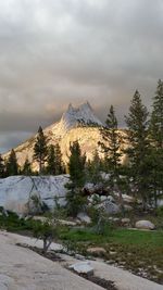 Scenic view of mountains against cloudy sky