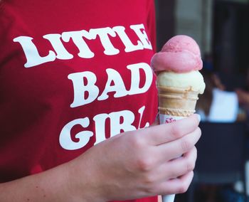 Close-up of hand holding ice cream cone