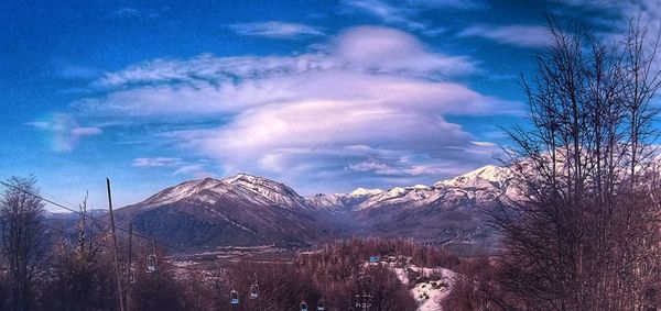 Scenic view of mountains against sky during winter