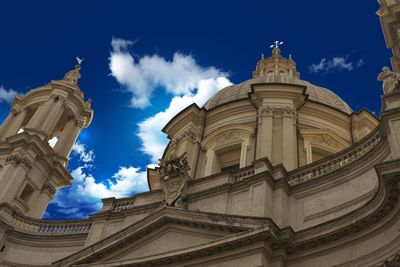 Low angle view of temple against cloudy sky