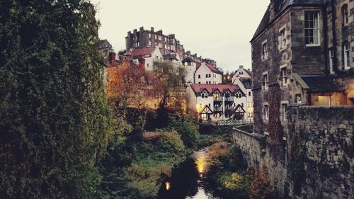 Canal by buildings in town