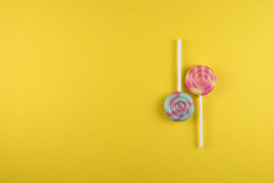 Lollipop over yellow background