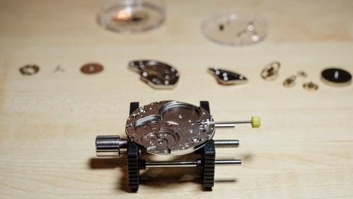 Watch mechanism on wooden table