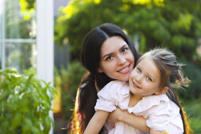 Portrait of happy mother and daughter