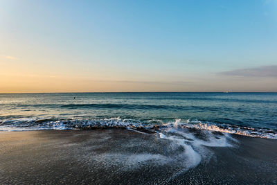 Scenic view of sea against sky during sunrise