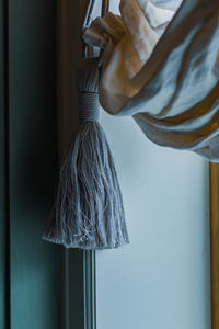 Close-up of clothes hanging on wall at home